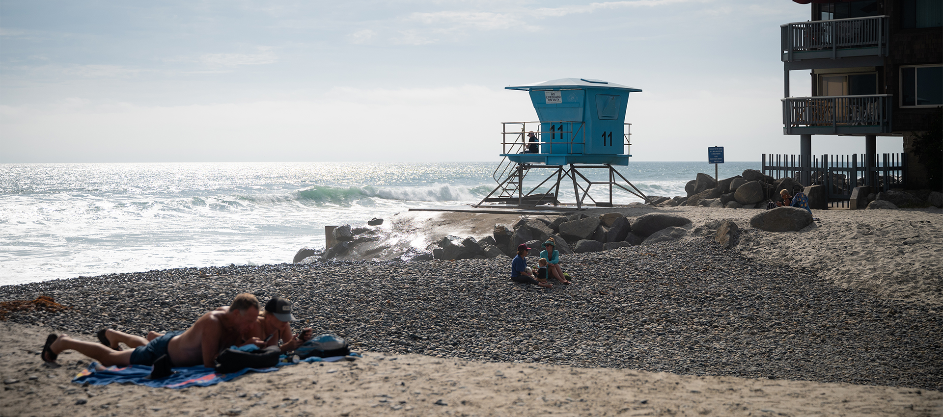 Couple relaxing on the beach in Oceanside CA